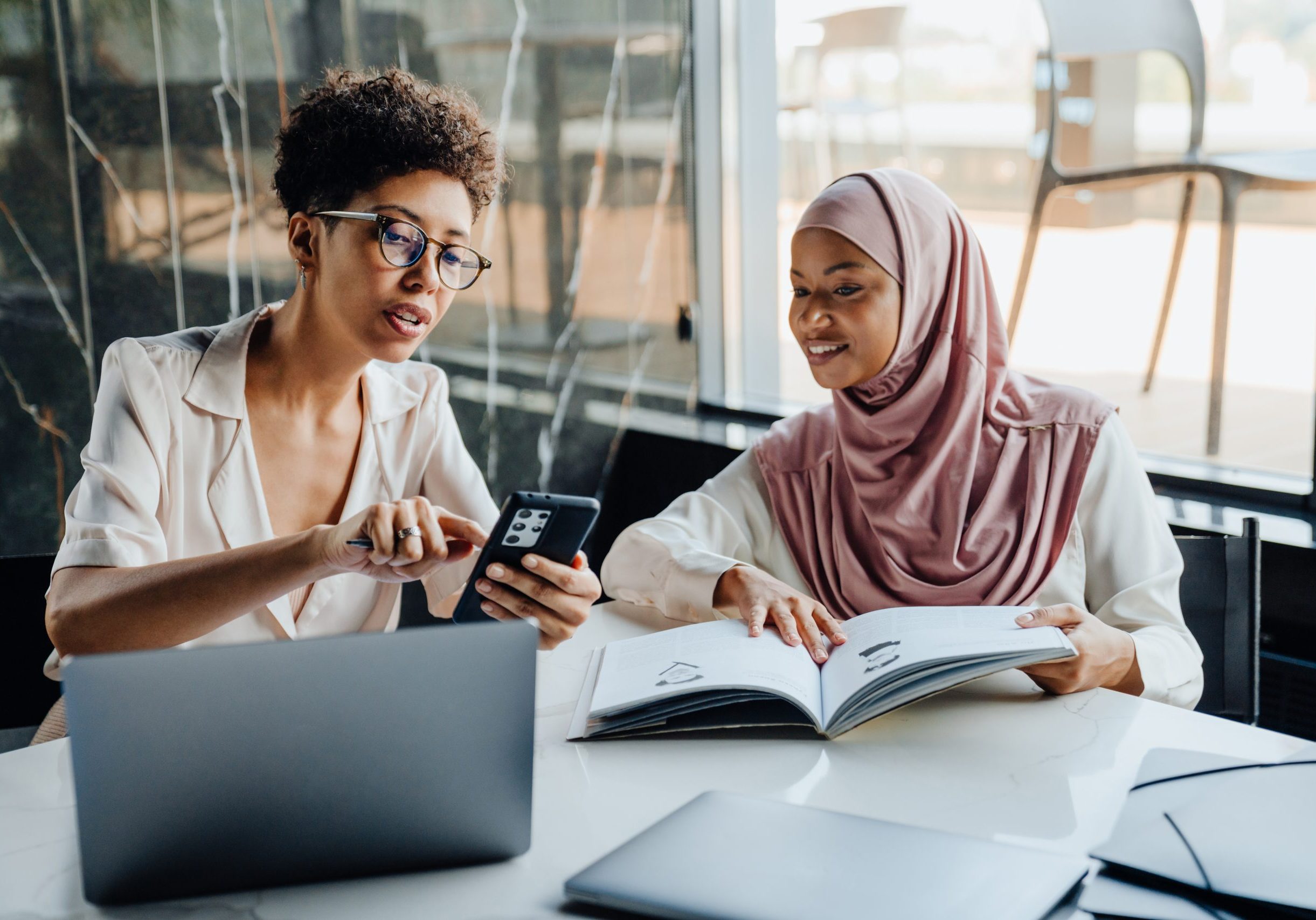 Female Career Educator and female muslim student working in advising meeting